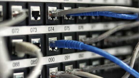 Ethernet cables plugged into numbered ports
