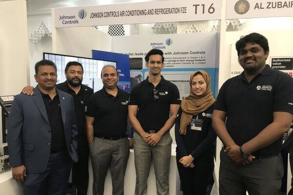 Group of volunteers and partners smiling for a picture at the Sharjah Energy Meet