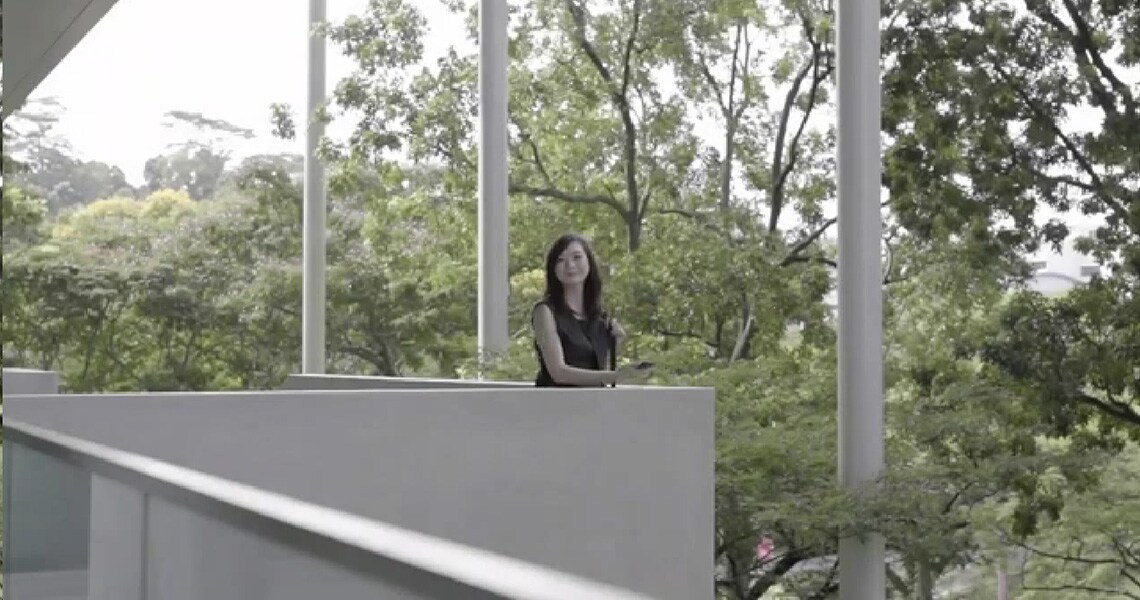 Woman in Balcony holding phone