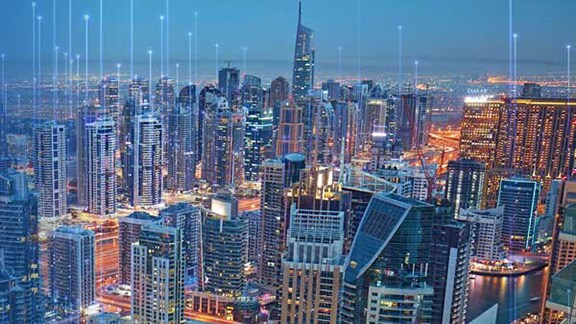 Bird's eye view of a sprawling cityscape at night