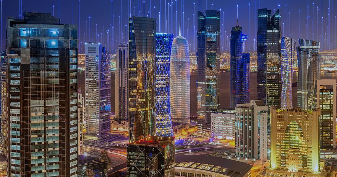 High-rise buildings lit up during night-time, overlaid with OprnBlue graphic