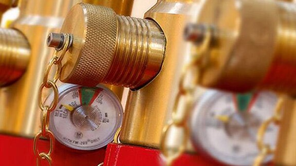 Close-up image of a pressure gauge installed in a gas supression system