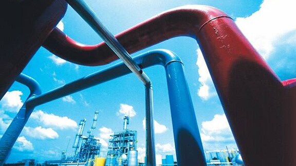 Low-angle view of refrigeration pipes installed at an outdoor space