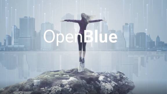 Back-view of a woman standing with her arms spread out