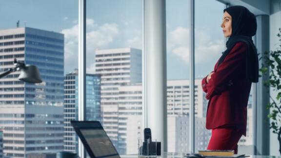 Side view of a businesswoman standing in an office