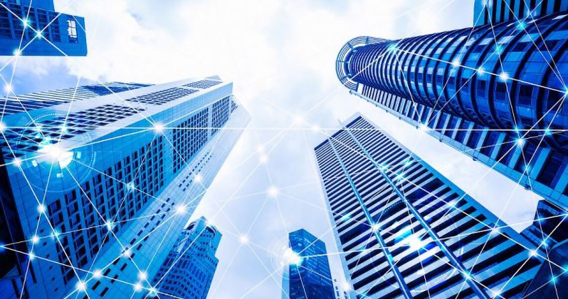 Low-angle shot of a group of high-rise buildings with an overlay of communication graphics