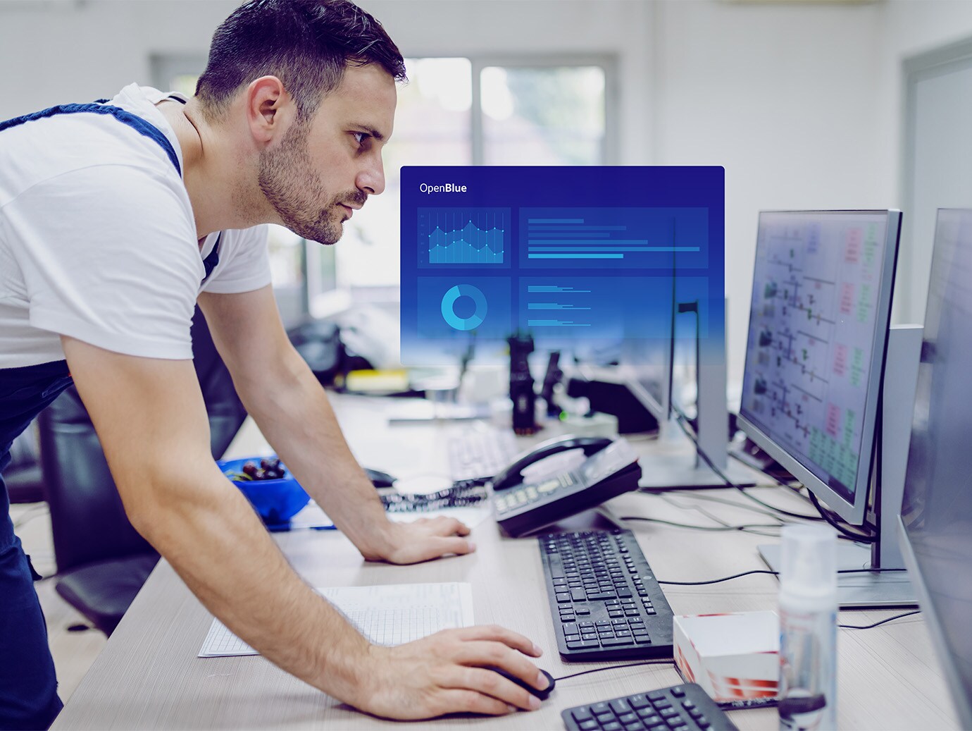 A men is working ion laptop
