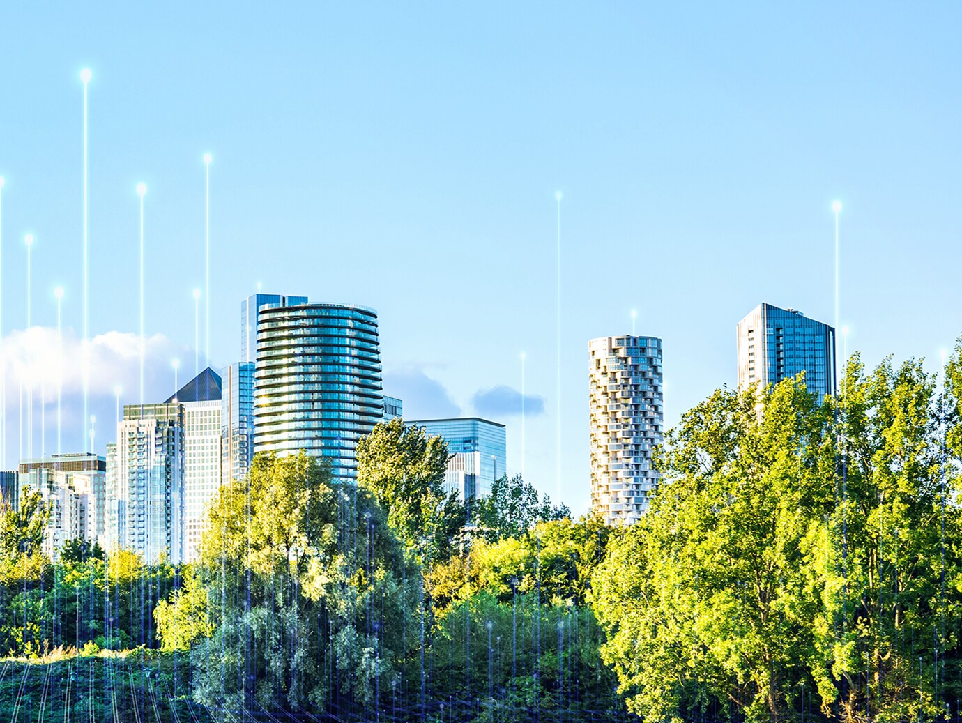 Cityscape behind lush trees with graphics depicting transmission nodes