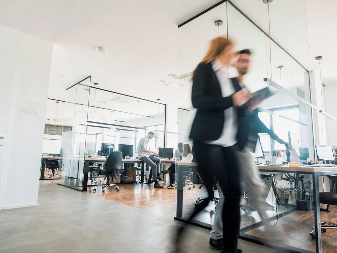 Employees walking in an office suite