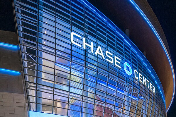 Close-up of the exterior of the Chase Center in San Francisco during night-time