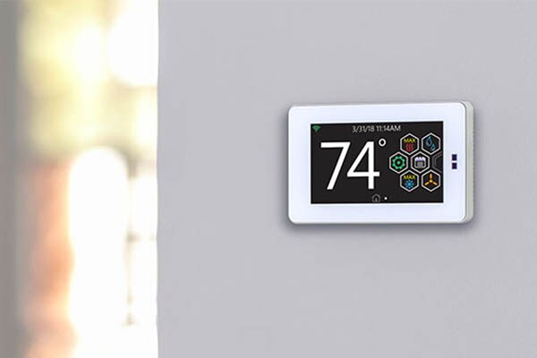 Temperature control panel mounted on the wall