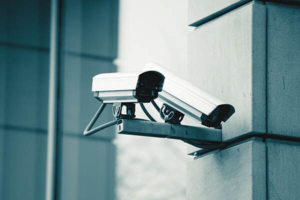 A security camera installed on the side of a building