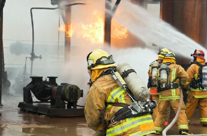 Fire fighters extinguishing a fire