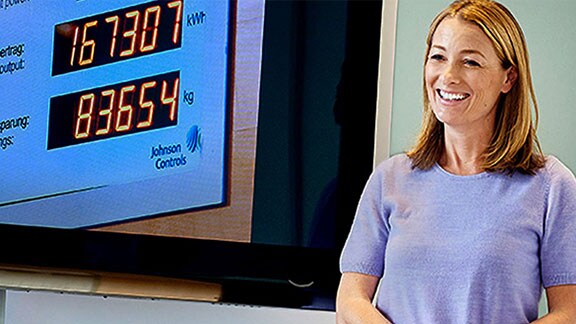 woman speaking in front of a projection
