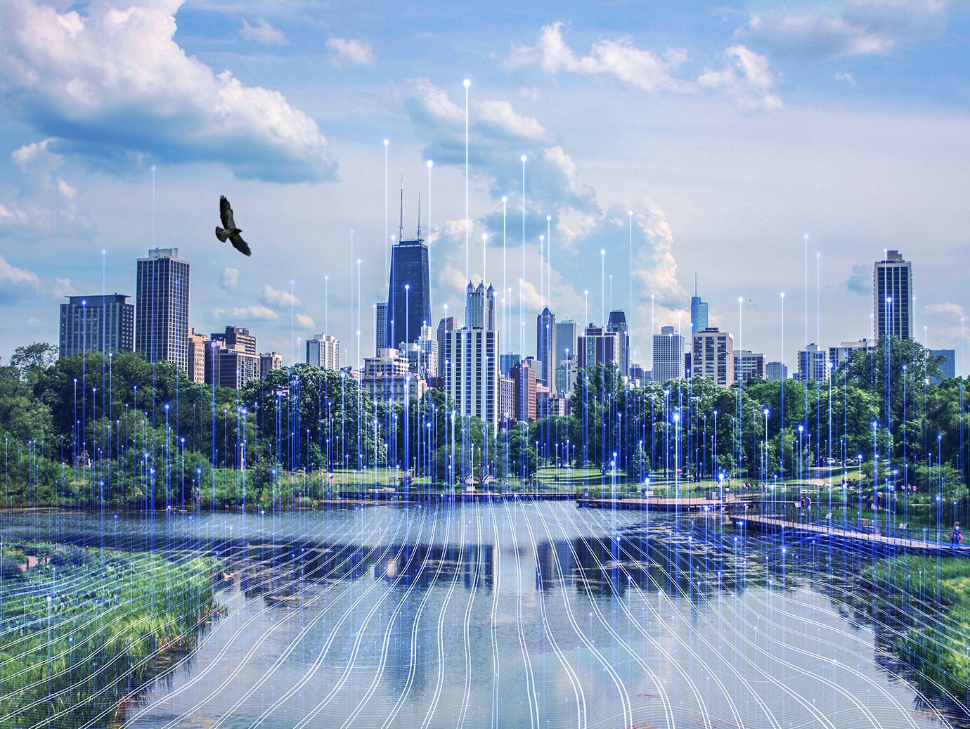 A cityscape at daytime, with a bird flying overhead, overlaid with OpenBlue graphics