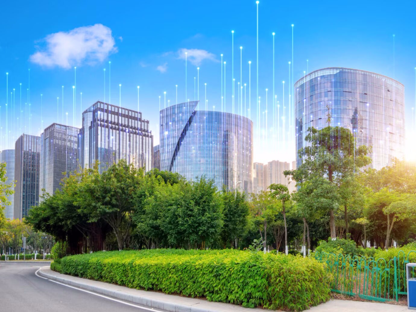 A business park with buildings and trees at daytime, surrounded by OpenBlue graphics