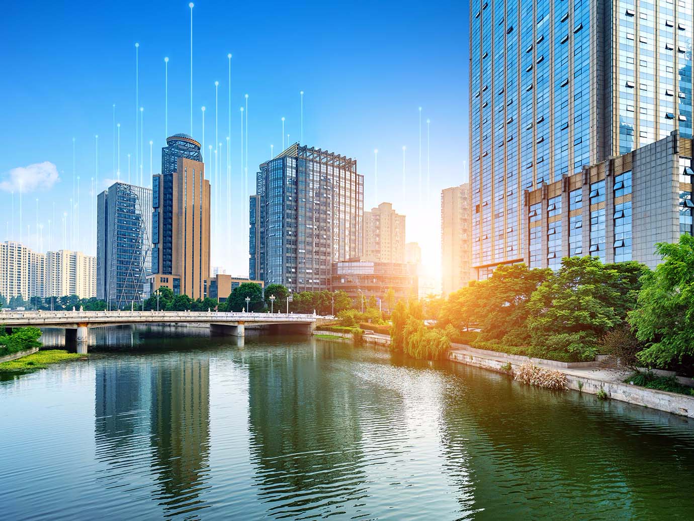 Skyscrapers on the banks of a water body, with OpenBlue graphics in the background