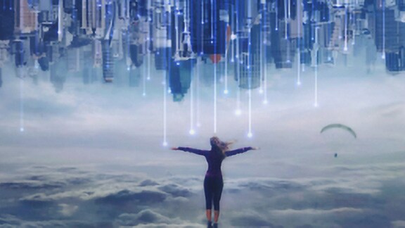 A woman standing and facing clouds and a skyline, overlaid with OpenBlue graphics