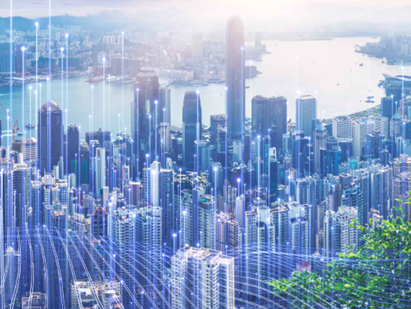 Aerial view of skyscrapers in a cityscape, ovrlaid with OpenBlue graphics