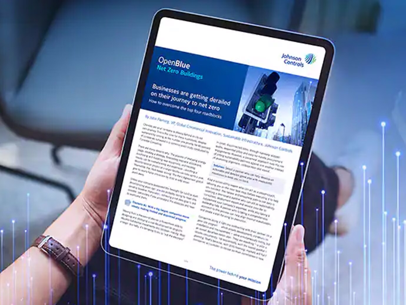 Close-up of a person looking at a tablet displaying an article on OpenBlue