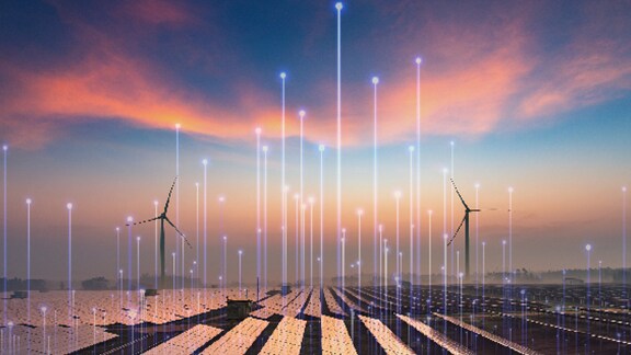 A wind turbine farm at sunset, overlaid with OpenBlue graphics