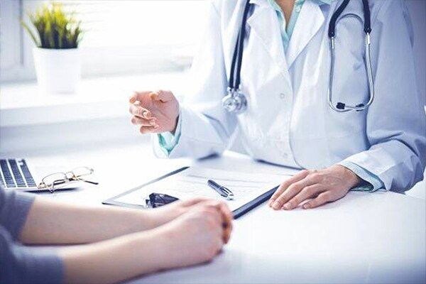 Healthcare professional talking to a patient