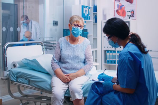 Nurse taking down report of a patient